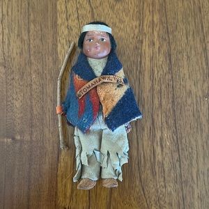 Young Native American with stick Skookum Doll
